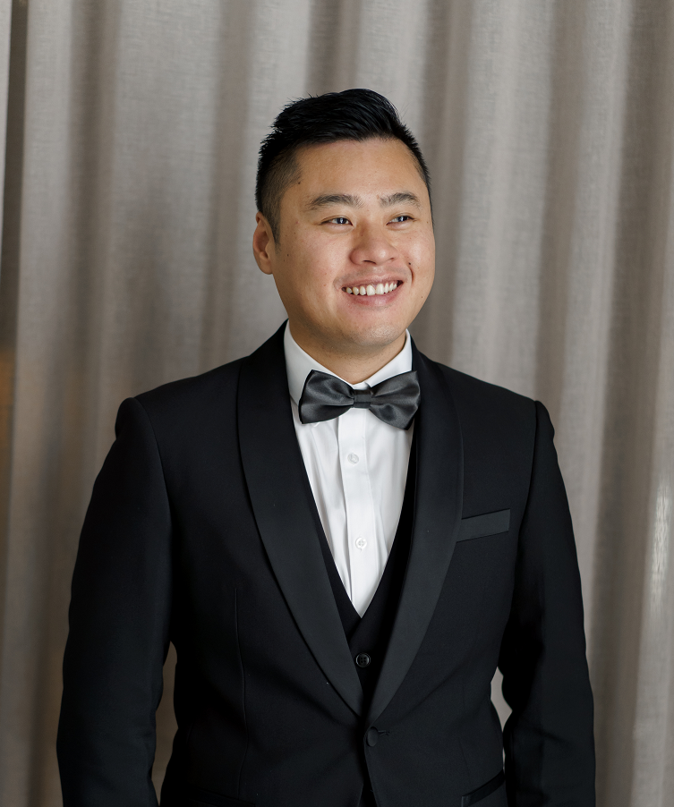 a man in a suit smiling